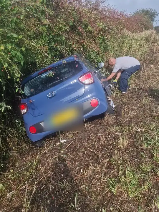 Hyundai i10 nose-down in a ditch, getting hooked up